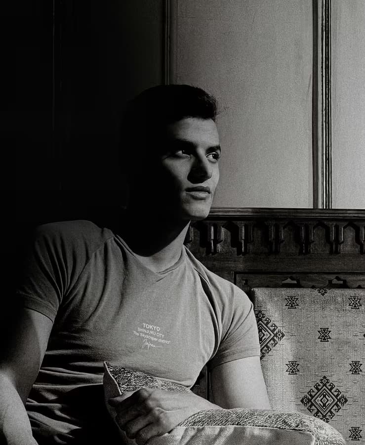 Portrait of Adel Thamid working on a project